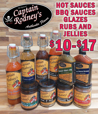 All-Natural Captain Rodney’s Authentic Flavor Sauces, Glazes, Rugs, and Jellies. Handmade in small batches using all-natural ingredients and time-honored recipes featuring Jamaican scotch bonnet peppers and Caribbean spices to create the finest in Caribbean and southern flavors. As The World Burns Hot Sauce $10, item number CRAWB, 6 point 7 fluid ounces. Combination of flavorful scotch bonnet peppers and sweet chilis for an in your face heat, balanced with a nice, smoky garlic finish. Sweet Envy Number 5 Hot Sauce $10, item number CRSE5, 6 point 7 fluid ounces. Rich flavor of serrano peppers with a bit of sweetness to balance its refreshing bite. Try it on street tacos, drizzled across a pork loin, as a hot relish replacement with beans and vegetables or add to scrambled eggs for an amazing update on huevos rancheros. Black Coffee Barbeque Sauce $17, item number CRBCBBQ, 15 and 3 quarter ounces. Combines dark, roasted coffee and a hint of balsamic vinegar. Excellent as a straightforward barbeque sauce, also great as a dipping sauce, adds flavor when mixed in with vegetables and adds a coffee kick to reductions. Spicy Peach Barbeque Sauce $17, item number CRSPBBQ, 17 ounces. Combines the unique flavorful heat of boucan spices with sweet peaches. Try it with any barbeque, on cedar-planked salmon, chicken, cheese dip, even cornbread. Temptation of Jezebel Sauce $11, item number CRJS, 11 and a half ounces. Sweet and tangy taste of the old south with tropical pineapples, sweet apples, cracked black pepper and a little horseradish for just the right amount of bite. Try it as a glaze over meat and vegetables or serve it as an appetizer with cream cheese and crackers. Original Boucan Glaze $17, item number CROGB, 18 ounces. Made with Jamaican scotch bonnet peppers, pure cane sugar and locally grown bell peppers, the perfect way to add flavor to any dish. Just the right blend of peppers and spices delivers a sweet heat that is hard to beat. Sweet Garlic Dipping and Grilling Glaze $17, item number CRSGG, 18 ounces. Excellent on chicken or pork loin, the flavor of sweet, rich, roasted garlic makes it an unforgettable dining experience. Great for dipping bread, chicken nuggets, and egg rolls or use it in a festive Italian cheeseball.