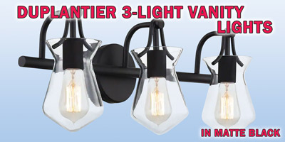 Ashley Harbour Duplantier 3-light vanity lights, our price $39, compare online for $114.82. Matte black fixture with clear glass shades, item number DS19229. 24 inches wide by 7 and a quarter inches deep by 10 inches high. Dimmable when paired with dimming-compatible bulbs. Can be installed facing up or down. Styles may vary by store. Hurry in for best selection. These are a special buy folks, so when they’re gone, they’re gone!