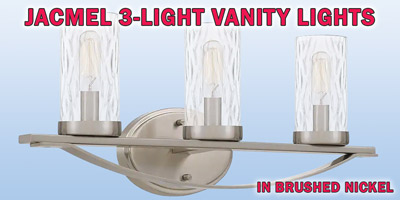 Ashley Harbour Jacmel 3-light vanity lights, our price $39, compare online for $115.85. Brushed nickel fixture with water glass shades, item number DS19207. 21 and a half inches wide by 5 inches deep by 8 inches high. Dimmable when paired with dimming-compatible bulbs. Styles may vary by store. Hurry in for best selection. These are a special buy folks, so when they’re gone, they’re gone!