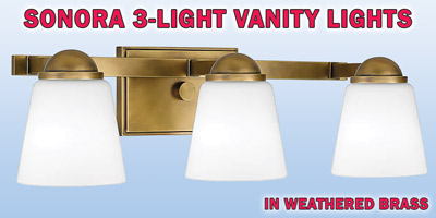 Ashley Harbour Sonora 3-light vanity lights, our price $39, compare online for $133.73. Weathered brass fixture with frosted glass shades, item number DS19190. 23 inches wide by 8 inches deep by 7 inches high. Dimmable when paired with dimming-compatible bulbs. Can be installed facing up or down. Styles may vary by store. Hurry in for best selection. These are a special buy folks, so when they’re gone, they’re gone!